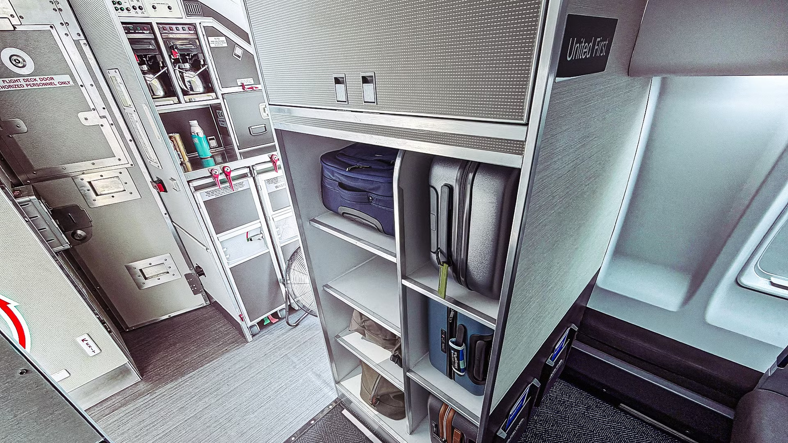 The Real Reason United Airlines Replaced First Class Overhead Bins With A Luggage Closet On Its New Regional Jet