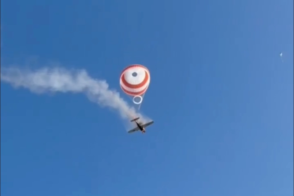 Pilot survives as burning Cirrus SR22 descends under parachute
