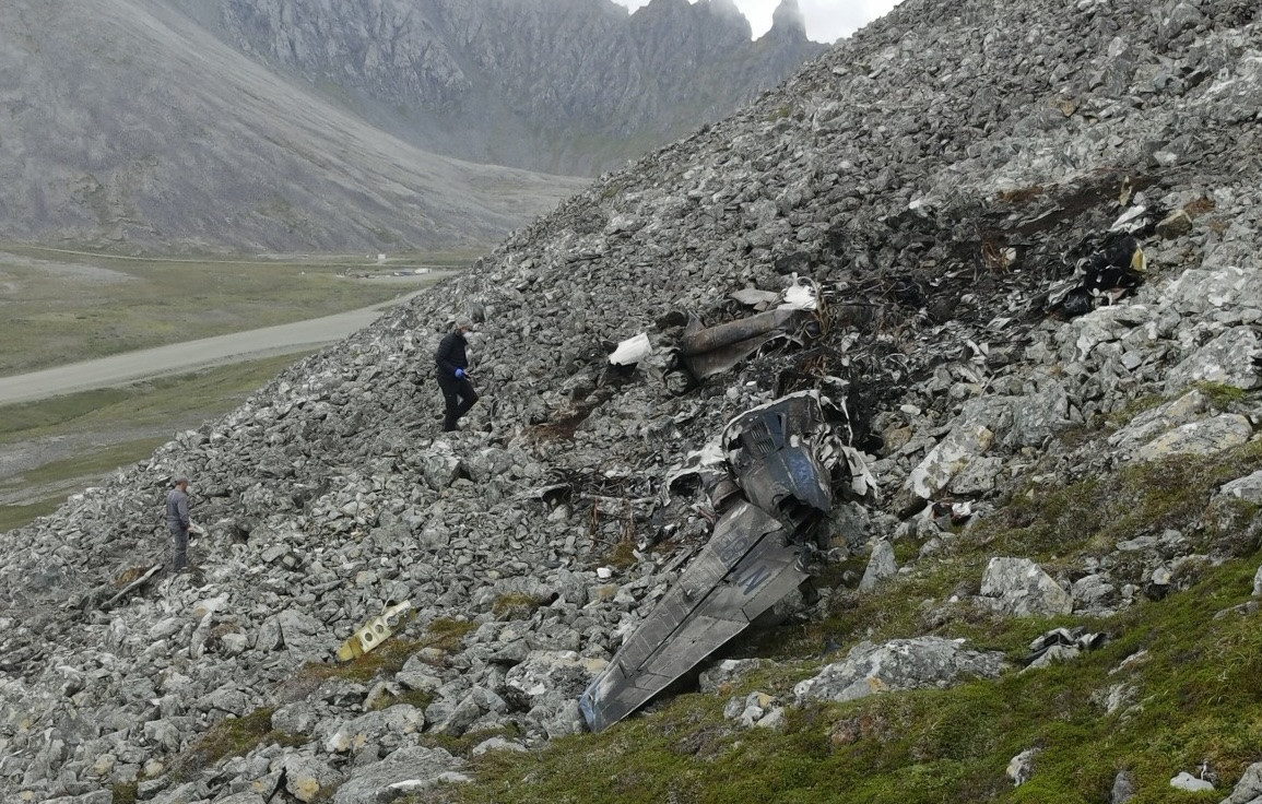 Cessna 441 bound for Alaskan radar site struck terrain after missed approach in poor weather
