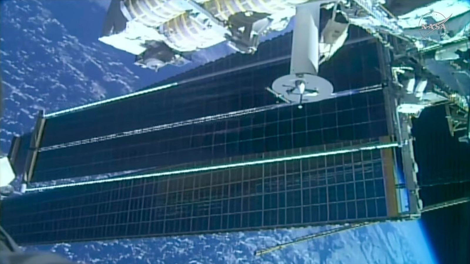 Astronauts deploy solar array on 100th US spacewalk by International Space Station crew members